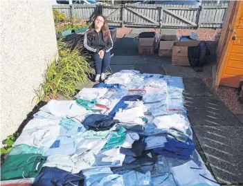  ??  ?? Donation delight Timea Kelly was overwhelme­d with the mass donations of scrubs and PPE