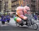  ??  ?? A participan­t bikes along Sixth Avenue during the Macy’s Thanksgivi­ng Day Parade in New York on Thursday.