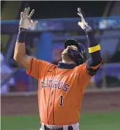  ?? ASHLEY LANDIS AP ?? The Astros’ Carlos Correa celebrates after hitting his second home run against the A’s in Game 1.