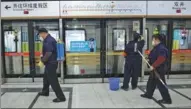  ?? ZOU HONG / CHINA DAILY ?? Cleaners disinfect a subway station in Beijing on Thursday. The capital has closed some metro stations to curb its COVID-19 outbreak.