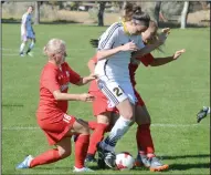  ?? NEWS PHOTO RYAN MCCRACKEN ?? Medicine Hat College Rattlers midfielder Meagan Clarke battles for the ball with three SAIT Trojans during Sunday's Alberta Colleges Athletics Conference women's soccer game at the Snake Pit.