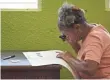  ?? CARLOS GIUSTI, AP ?? Puerto Rican resident Maria Quinones votes on on the island’s status, in San Juan.