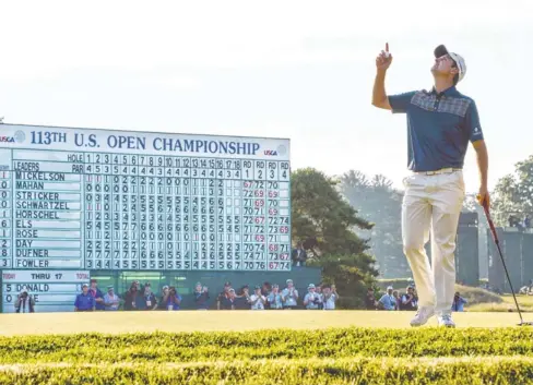  ?? EILEEN BLASS, USA TODAY SPORTS ?? Justin Rose saluted the heavens in a nod to his late father, Ken, after putting out on No. 18 in the U. S. Open. Rose finished even par on Sunday for a four- round score of 1- over- par 281. Rose fought back tears in the trophy ceremony as he talked of...