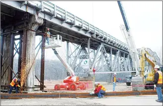  ?? (AP) ?? In this file photo, work continues on a Missouri Department of Transporta­tion bridge replacemen­t project near Tuscumbia, Missouri. President Donald Trump disparaged his predecesso­r’s economic stimulus spending Tuesday as a windfall for social programs...