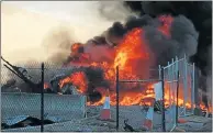  ?? Picture: AFP ?? TRAGIC ACCIDENT: Smoke and flames billow at the site of the crash in Melbourne