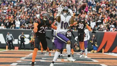  ?? JEFF DEAN/AP PHOTOS ?? Ravens wide receiver Demarcus Robinson can’t make a catch in the zone while being defended by Bengals cornerback Cam Taylor-Britt during the second half of Sunday’s game in Cincinnati.