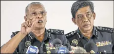  ?? VINCENT THIAN / AP ?? Deputy National Police Chief of Malaysia Noor Rashid Ibrahim (left) said authoritie­s are trying to understand why the half-brother of North Korean leader Kim Jong Un was fatally poisoned in Malaysia.