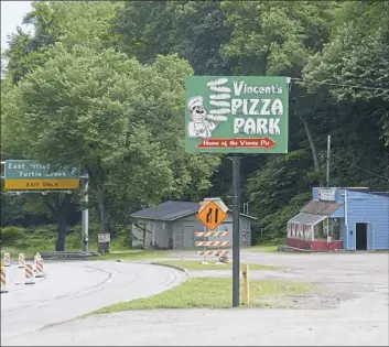  ?? Lake Fong/Post-Gazette ?? A sign for Vincent’s Pizza Park along Route 30 in East Pittsburgh.