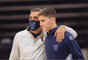  ?? Laurence Kesterson / Associated Press ?? Villanova coach Jay Wright, left, and guard Collin Gillespie are shown before a game against Creighton on March 3.