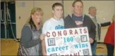  ??  ?? Neshaminy senior Ryan O’Connor is congratula­ted after earning his 100th career win last month in a ‘Skins win at home against Bensalem.