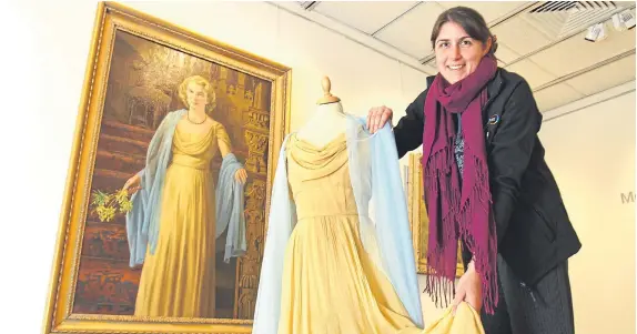  ?? Picture: Gareth Jennings. ?? Visual arts officer Gill Ross with the portrait of Lady Sophie Lyell by artist James McIntosh Patrick, which is on show at the Meffan in Forfar, along with the dress worn in the painting.