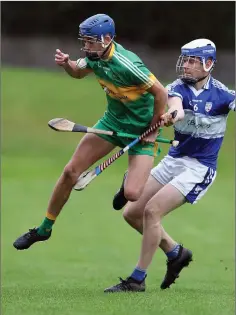  ??  ?? Kilcoole’s Eoin Keddy comes under pressure from Michael Cullen.