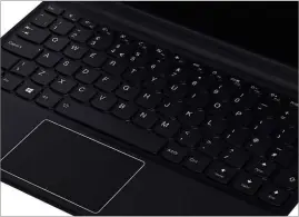  ??  ?? BELOW As premium laptops become smaller and thinner, makers are employing space-saving keyboard designs