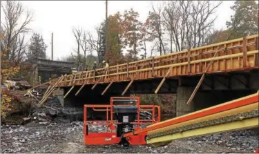  ?? EVAN BRANDT — DIGITAL FIRST MEDIA ?? Work on the new Grosstown Road Bridge over Manatawny Creek in West Pottsgrove is nearly complete.