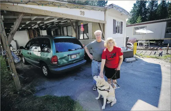  ?? MARK VAN MANEN/PNG ?? Christine Bublitz, who is legally blind, and Paul McDermott stand outside their mobile home in Surrey on Monday. They say they’re worried about being relocated from their home to make way for a new seniors’ facility.