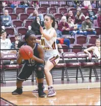  ?? The Sentinel-Record/Grace Brown ?? PRESS: Lake Hamilton sophomore Bre Nash (11) pressures J.A. Fair senior Jada Evans (10) Friday during the Lady Wolves’ 61-38 home win at Wolf Arena in Pearcy.