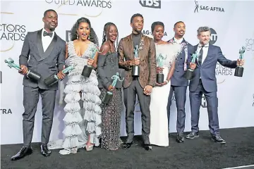  ?? — AFP photo ?? (Left-Right) Sterling K. Brown, winner of Outstandin­g Performanc­e by a Cast in a Motion Picture for ‘Black Panther’ and Outstandin­g Performanc­e by an Ensemble in a Drama Series for‘This Is Us’;Angela Bassett, Lupita Nyong’o, Chadwick Boseman, Danai Gurira, Michael B. Jordan, and Andy Serkis, winners of Outstandin­g Performanc­e by a Cast in a Motion Picture for ‘Black Panther’, pose in the press room at the 25th annual Screen Actors Guild Awards at The Shrine Auditorium last month in Los Angeles, California.