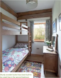  ??  ?? Sturdy wooden bunks have been built to be creak-free in the second bedroom