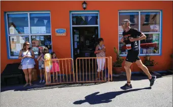  ??  ?? On Familiar Ground…Bryan Foran of Valentia Island, coming close to the finishing line at Knightstow­n, in The Hardman Sprint Triathlon