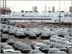  ?? AP/CARLOS OSORIO ?? Jeep vehicles are parked outside Fiat Chrysler’s Jefferson North Assembly plant in Detroit, near the 200 acres of land where the company plans to build an engine plant.