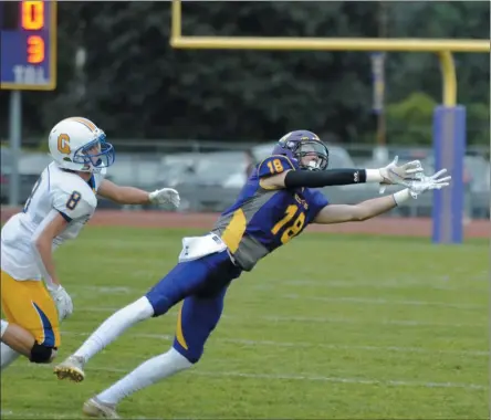  ?? STAN HUDY/THE SARATOGIAN ?? Ballston Spa wide receiver Tyler Beverly reaches out for a pass from Scotties quarterbac­k Keegan Zoller in the first half of Friday’s state wide opening night of high school football.