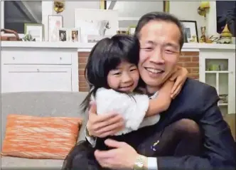  ?? NBC VIA AP ?? In this video grab issued Sunday, Feb. 28, 2021, by NBC, director Lee Isaac Chung is hugged by his daughter as he accepts the award for best foreign language motion picture for “Minari” from the United States at the Golden Globe Awards.