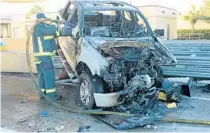  ?? ORLANDO POLICE DEPARTMENT ?? A firefighte­r tends to Frederick Rolle’s truck after a fiery crash on State Road 408 in November 2017.