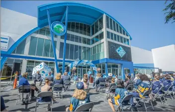  ?? Bobby Block/The Signal ?? (Above) Santa Clarita Mayor Bill Miranda addresses a crowd during the opening of The Cube — Ice and Entertainm­ent Center on Monday morning, crediting a community effort with inspiring the city’s purchase of the rink. (Below) Former Los Angeles Kings player Luc Robitaille addresses the crowd gathered to celebrate the opening of The Cube, the former site of Ice Station Valencia. Robitaille applauded the city for saving the rink.