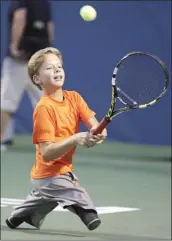  ??  ?? BRAVE LITTLE WONDER: Conner Stroud, 13-years-old of Forest City, North Carolina, shows off his tennis skills during an exhibition for adaptive tennis on day three of the Winston-Salem Open in North Carolina.