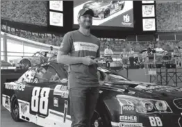  ?? JEFF SINER, THE CHARLOTTE OBSERVER ?? Dale Earnhardt Jr. poses with a die cast of the No. 88 Nationwide Chevrolet he’ll drive in his final Bojangles’ Southern 500 at Darlington Raceway in September.