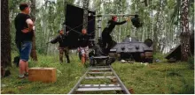  ?? — AFP photos ?? A film crew shooting a scene of the movie - currently with the working title "To See Stalin" - in a forest near Voskresens­k, outside Moscow.