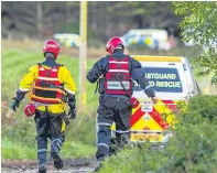  ??  ?? Rescue workers at the scene of the fatal accident