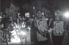  ?? JUSTIN SULLIVAN/GETTY IMAGES ?? Black Lives Matter protesters march through the streets on March 4 as they demonstrat­e the decision by Sacramento District Attorney to not charge the Sacramento police officers who shot and killed Stephon Clark.