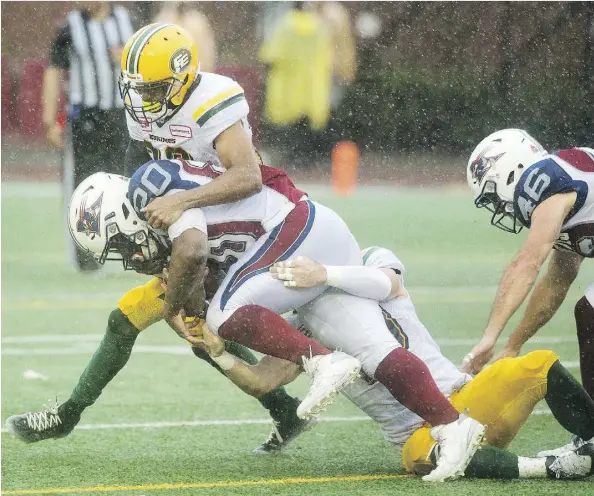  ?? GRAHAM HUGHES/THE CANADIAN PRESS ?? The Eskimos defence stood tall when needed against Tyrell Sutton and the Montreal Alouettes to wipe out an early 15-0 deficit in their game on Monday. Edmonton had dropped six consecutiv­e games following a 7-0 start heading into the soggy contest.