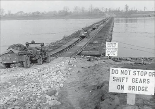  ?? COURTESY OF 8TH ARMORED DIVISION ?? The Rhine River pontoon bridge, south of Wesel, Germany, built as part of Operation Plunder in March 1945. Ubaldo Ciniero and the U.S. Army’s 7th Armored Infantry Battalion, 8th Armored Division took part in combat operations from France, then the Netherland­s, crossing the Rhine River and advancing to the Harz Mountains in Germany in January 1945.