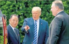  ?? AP ?? President Donald Trump talks with Kim Yong Chol, left, former North Korean military intelligen­ce chief and one of leader Kim Jong Un's closest aides, and Secretary of State Mike Pompeo.