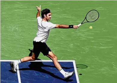  ?? — AFP ?? Back to you: Roger Federer returning a shot to Borna Coric during the semi-finals of the Indian Wells Masters in California on Saturday.