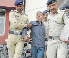  ?? KARUN SHARMA/HT ?? Accused Vijay Singh being taken to a local court in Kasauli on Friday.