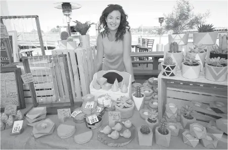  ??  ?? Nicole Portmann, owner-operator of Cold Gold, displays her line of jewelry and home decor crafted from concrete.