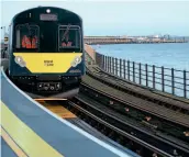  ?? ?? Class 484 No. 484001 on Ryde Pier with the first of the relaunched Island Line services on November 1, continuing a tradition of the line using recycled London Undergroun­d stock.
SOUTH WESTERN RAILWAY