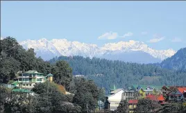  ?? DEEPAK SANSTA /HT ?? ■ A view of snow-covered mountains from The Ridge in Shimla. The higher reaches of Himachal received fresh snowfall on Tuesday.