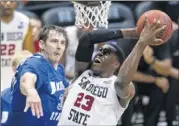  ?? EUGENE TANNER / ASSOCIATED PRESS ?? Indiana State’s R.J. Mahurin guards Deshawn Stephens on Sunday.