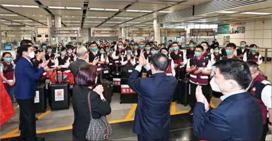  ?? PROVIDED TO CHINA DAILY ?? Chinese mainland medical workers leave Shenzhen Bay Port for Hong Kong on March 14 to support the local fight against the COVID-19 epidemic. The team includes 36 doctors and 39 nurses from 14 public hospitals in neighborin­g Guangdong province.
