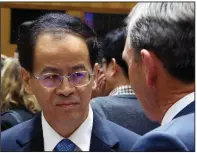  ?? AP/ROD McGUIRK ?? Chinese Ambassador to Australia Cheng Jingye talks to Australia-China Business Council National President John Brumby (right) before he gives a speech Tuesday to a business forum in Australia’s Parliament House in Canberra.