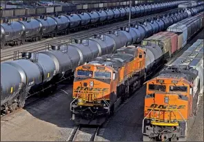  ?? The Bismarck Tribune/ TOM STROMME ?? Dozens of oil tanker railcars sit in the Mandan rail yard Friday in Mandan, N. D. The drop in global oil prices, partially because of the North American shale oil boom, has strained budgets and relationsh­ips across the Persian Gulf and in other oil-...