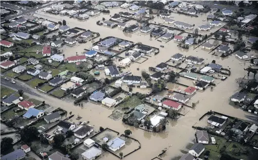  ?? PHOTO: THE NEW ZEALAND HERALD ?? Westport could have been protected from the devastatio­n of last week’s oneinahund­redyear flood if a proposed multimilli­ondollar flood protection scheme was already in place, a West Coast Regional Council staff member says.