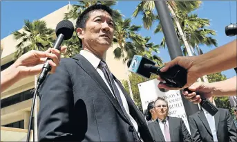  ?? Picture: REUTERS ?? LINE IN THE SAND: Hawaii Attorney-General Douglas Chin talks to the media at the US District Court Ninth Circuit after filing an amended lawsuit against President Donald Trump’s new travel ban in Honolulu