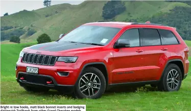  ??  ?? Bright re tow hooks, matt black bonnet inserts and badging distinguis­h Trailhawk from other Grand Cherokee models