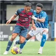  ?? ?? Ross County’s Owura Edwards (left) going past Kilmarnock’s Ryan Alebiosu earlier this season