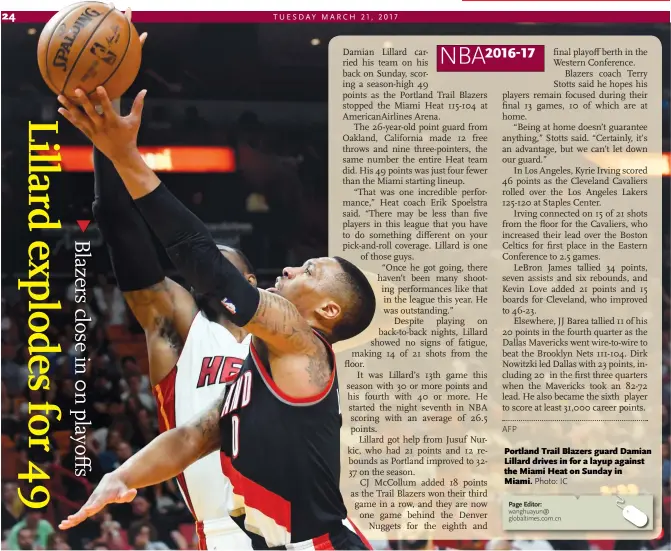  ??  ?? Portland Trail Blazers guard Damian Lillard drives in for a layup against the Miami Heat on Sunday in Miami.